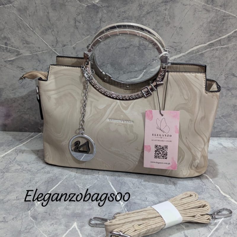 elegant cross body bag with duck keychain