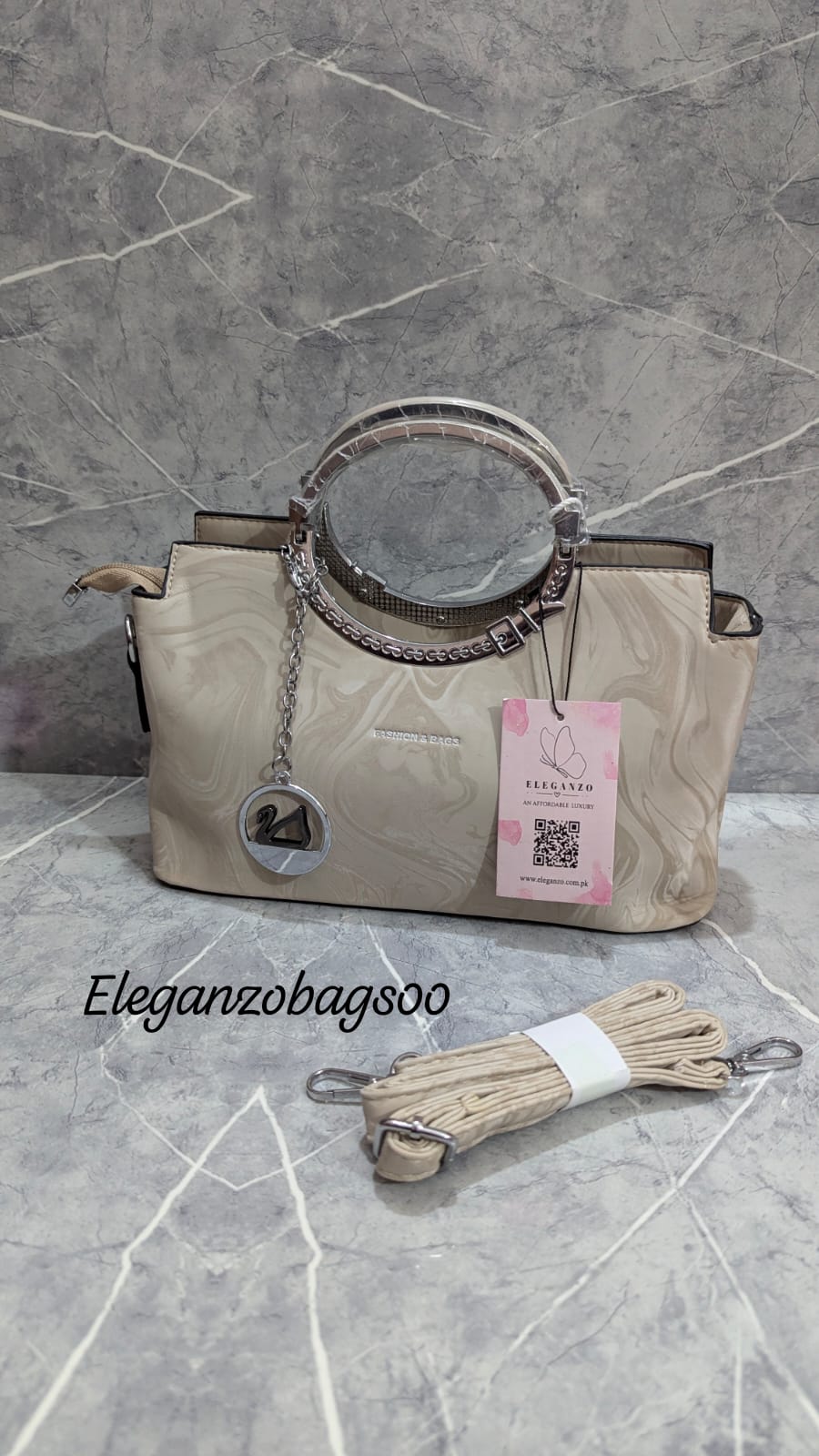 elegant cross body bag with duck keychain